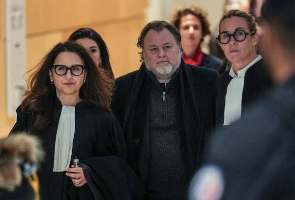 French filmmaker Christophe Ruggia arrives with his legal team at courthouse in Paris, Monday, Feb. 3, 2025. (AP Photo/Aurelien Morissard)