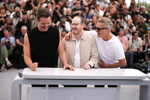 Pedro Pascal, from left, director Ari Aster and Joaquin Phoenix pose for photographers at the photo call for the film 'Eddington' at the 78th international film festival, Cannes, southern France, Saturday, May 17, 2025. (Photo by Scott A Garfitt/Invision/AP)