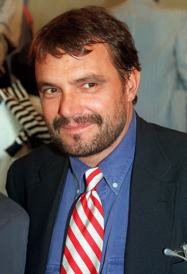 FILE - Benetton creative director and photographer Oliviero Toscani smiles in this 1993 file photo taken in Milan, Italy. (AP Photo/Luca Bruno, File)