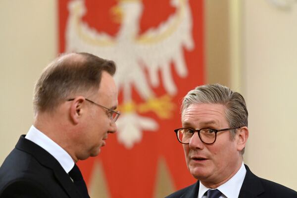 Poland's President Andrzej Duda welcomes Britain's Prime Minister Keir Starmer in Warsaw, Poland, Friday Jan. 17, 2025. (Sergei Gapon/Pool via AP)