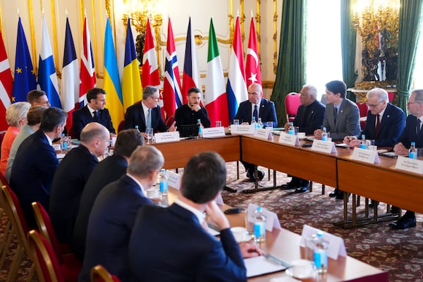 Canada Prime Minister Justin Trudeau, third from right, looks towards Britain's Prime Minister Keir Starmer and Ukrainian President Volodymyr Zelenskyy as they take part in a plenary during the Securing our Future Summit on Ukraine and European security at Lancaster House in London, Sunday, March 2, 2025. (Sean Kilpatrick/The Canadian Press via AP)