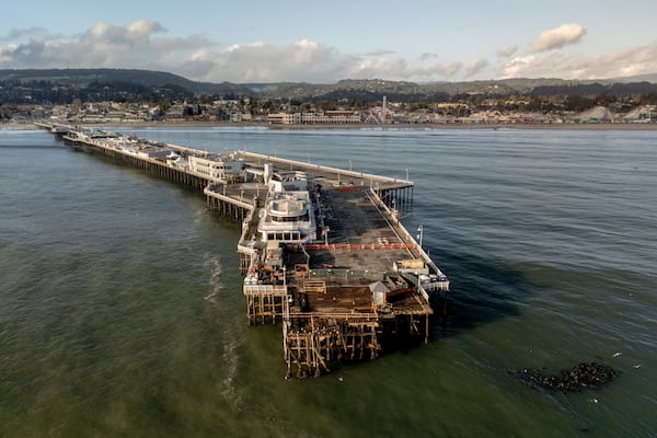 The damaged Santa Cruz Wharf is seen after a section of the pier fell into the ocean during high surf the previous day, in Santa Cruz, Calif., Tuesday, Dec. 24, 2024. (Stephen Lam/San Francisco Chronicle via AP)