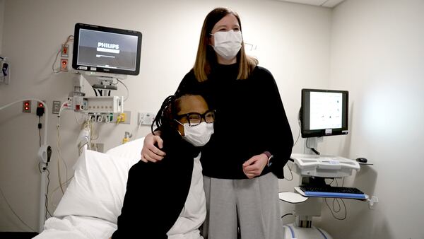 Pig kidney recipient Towana Looney sits with transplant surgeons Dr. Jayme Locke on Dec. 10, 2024, at NYU Langone Health, in New York City. (AP Photo/Shelby Lum)