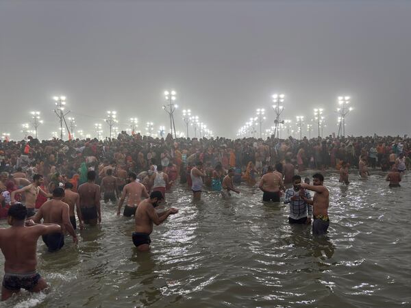 Hindus bathe at the confluence of the Ganges, the Yamuna and the mythical Saraswati rivers on Makar Sankranti, an auspicious day of the 45-day-long Maha Kumbh festival in Prayagraj, India, Tuesday, Jan. 14, 2025. (AP Photo/Ashwini Bhatia)