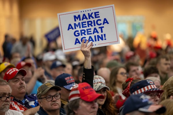 FILE - A Trump supporter holds up a MAGA sign during a rally for Republican presidential candidate, former President Donald Trump, in Green Bay, Wis., April 2, 2024. (AP Photo/Mike Roemer, File)