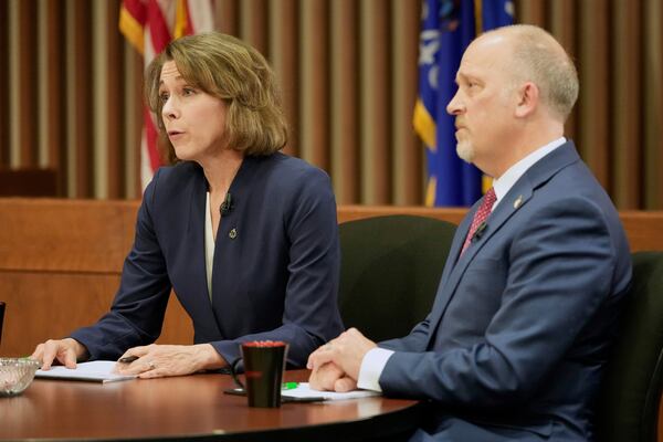 Wisconsin Supreme Court candidates Brad Schimel and Susan Crawford participate in a debate Wednesday, March 12, 2025, in Milwaukee. (AP Photo/Morry Gash)