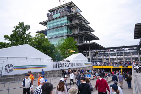 Fans make their way into the track before the start of the Indianapolis 500 auto race at Indianapolis Motor Speedway in Indianapolis, Sunday, May 25, 2025. (AP Photo/Michael Conroy)
