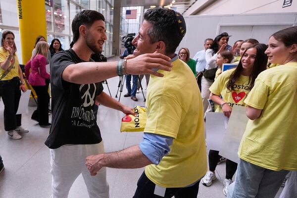 Omer Shem Tov, an Israeli hostage who survived over 500 days in Hamas captivity, is welcomed during his arrival at Logan Airport, Thursday, May 15, 2025, in Boston. (AP Photo/Charles Krupa)