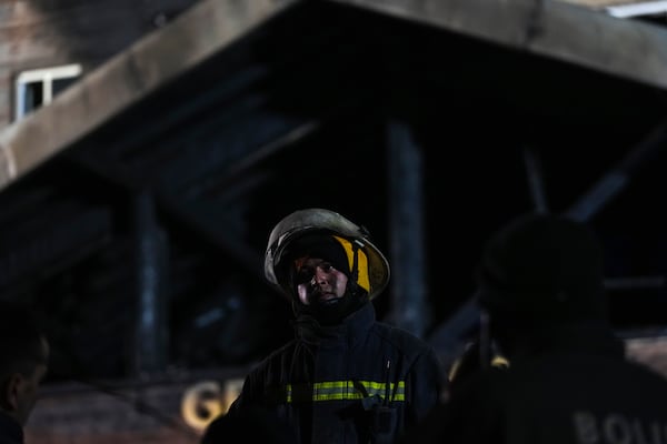 Firefighters and emergency teams work after a fire that broke out at a hotel in the ski resort of Kartalkaya, located in Bolu province, northwest Turkey, on Tuesday, Jan. 21, 2025. (AP Photo/Francisco Seco)