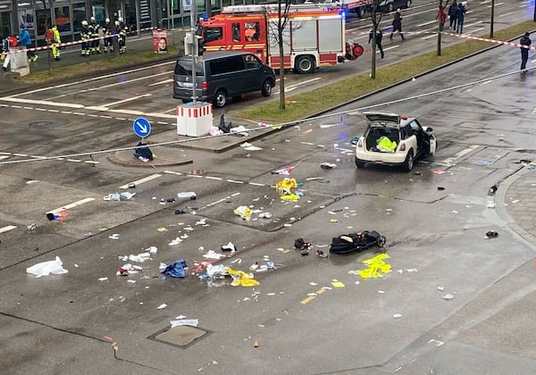 Emergency services attend the scene of an accident after a driver hit a group of people in Munich, Germany, Thursday Feb. 13, 2025. (Alexa Gr'f/dpa via AP)