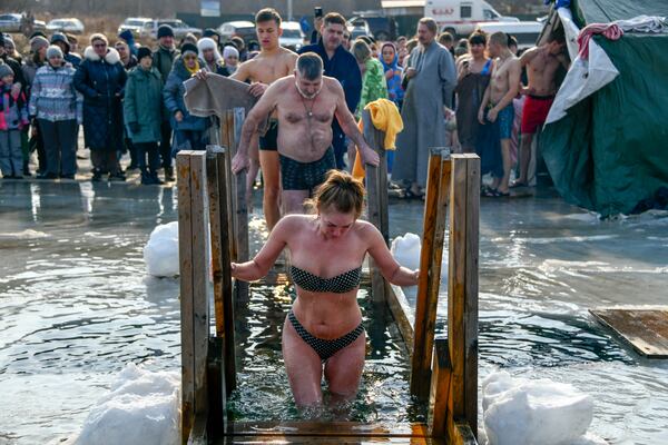 FILE - People plunge in icy water to celebrate the Russian Orthodox feast of Epiphany near the St. Serafimovsky Monastery in the Far East port Vladivostok, Russia, Jan. 19, 2025. (AP Photo, File)