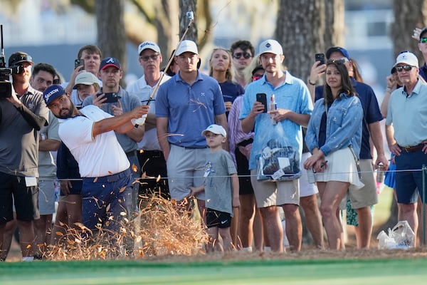 J.J. Spaun hits his second shot on the 15th hole during the third round of The Players Championship golf tournament Saturday, March 15, 2025, in Ponte Vedra Beach, Fla. (AP Photo/Chris O'Meara)