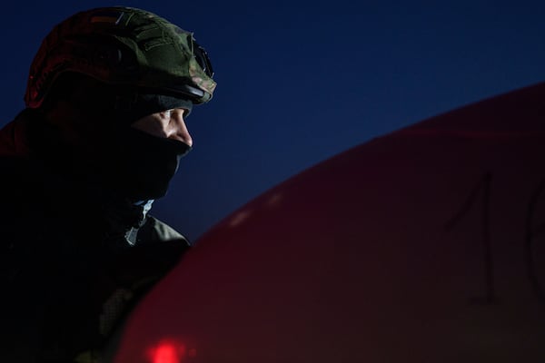 An Ukrainian serviceman of the Defence Intelligence prepares to launch long-range drone An-196 Liutyi in undisclosed location, Ukraine, Feb. 28, 2025. (AP Photo/Evgeniy Maloletka)