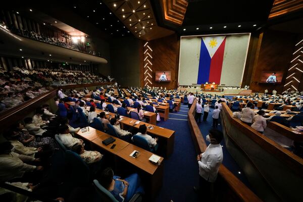 FILE- Lawmakers listen as new Philippine President Ferdinand Marcos Jr. delivers his first state of the nation address in, Quezon city, Philippines, Monday, July 25, 2022. (AP Photo/Aaron Favila, File)