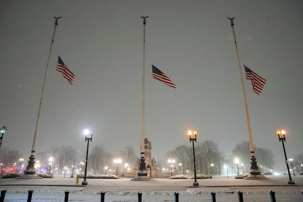 Flags fly at half-staff in memorial to former President Jimmy Carter during a winter snow storm at Union Station in Washington, Monday, Jan. 6, 2025. Carter died at age 100. (AP Photo/Matt Rourke)