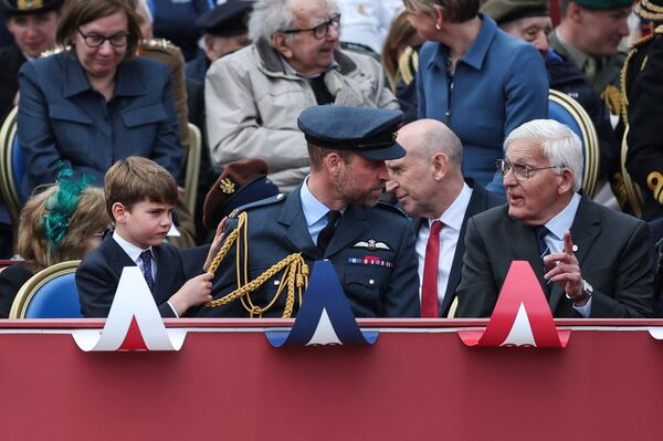 Britain's Prince William and Prince Louis watch the military procession marking the 80th anniversary of V-E Day, in London, Monday, May 5, 2025. (Toby Melville/Pool Photo via AP)