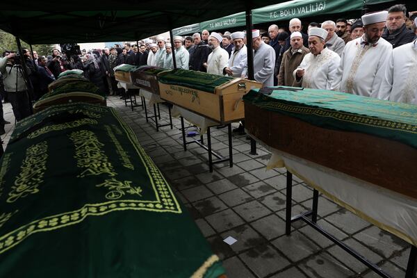 People attend the funeral of members of the Gultekin family at the Kalici Konutlar Merkez mosque in Bolu, northwest Turkey, on Wednesday, Jan. 22, 2025. Eight members of the Gultekin family died in a fire that broke out at the Kartalkaya ski resort in Bolu province. (Adem Altan/Pool Photo via AP)