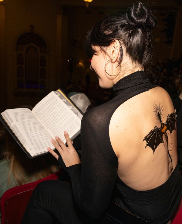 Audience member attend author Rebecca Yarros in conversation of her new book "Onyx Storm" at The Town Hall on Friday, Jan. 24, 2025, in New York. (Photo by CJ Rivera/Invision/AP)