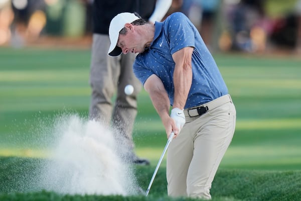 Rory McIlroy hits out of a fairway bunker on the 15th hole during the third round of The Players Championship golf tournament Saturday, March 15, 2025, in Ponte Vedra Beach, Fla. (AP Photo/Chris O'Meara)