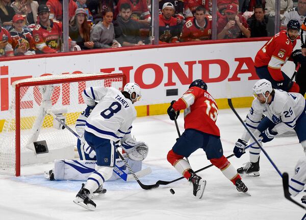 Florida Panthers center Sam Reinhart (13) tries to score against the Toronto Maple Leafs during the first period of Game 4 of a second-round NHL hockey playoff series, Sunday, May 11, 2025, in Sunrise, Fla. (AP Photo/Michael Laughlin)