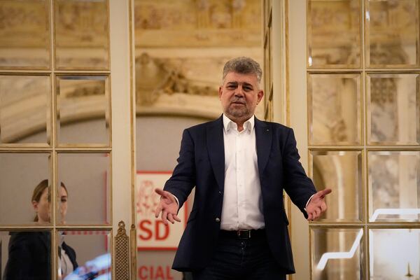 Romanian Prime Minister Marcel Ciolacu gestures at the PSD headquarters before announcing his resignation, in Bucharest, Romania, Monday, May 5, 2025, the day after the governing coalition's candidate failed to advance to the runoff in the presidential election rerun. (AP Photo/Andreea Alexandru)
