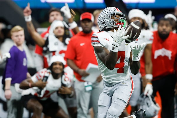 Ohio State wide receiver Jeremiah Smith catches a pass against Notre Dame during second half of the College Football Playoff national championship game Monday, Jan. 20, 2025, in Atlanta. (AP Photo/Butch Dill)