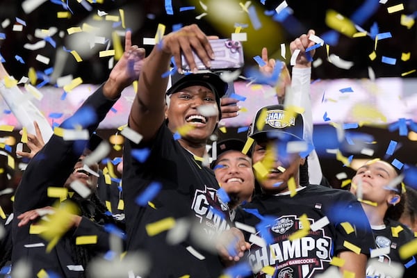 South Carolina forward Sania Feagin takes a selfie after their win against Texas in an NCAA college basketball game in the final of the Southeastern Conference tournament, Sunday, March 9, 2025, in Greenville, S.C. (AP Photo/Chris Carlson)