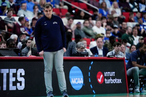 Mount St. Mary's head coach Donny Lind watches during the first half in the first round of the NCAA college basketball tournament against Duke, Friday, March 21, 2025, in Raleigh, N.C. (AP Photo/Stephanie Scarbrough)