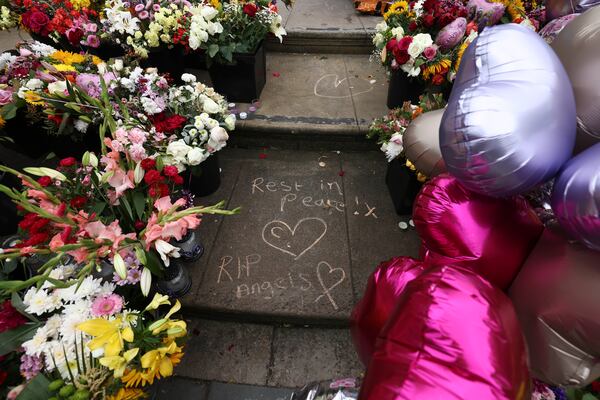 FILE - Tributes are seen outside the Town Hall in Southport, England, Monday, Aug. 5, 2024 after three young girls were killed in a knife attack at a Taylor Swift-themed holiday club the week before. (AP Photo/Darren Staples, File)