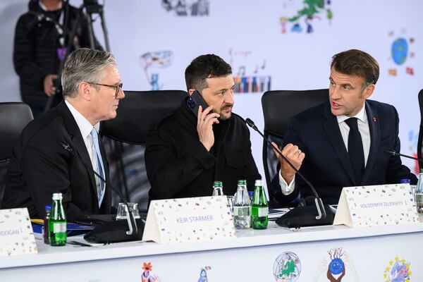 Britain's Prime Minister Keir Starmer, left, Ukraine's President Volodymyr Zelenskyy and France's President Emmanuel Macron, right, attend a plenary meeting at the beginning of a summit where the leaders of 47 European countries and organizations will discuss security, defense and democratic standards, in Tirana, Albania, Friday, May 16, 2025. (Leon Neal/Pool via AP)