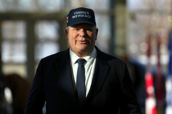 Ontario Premier Doug Ford arrives for a first ministers meeting in Ottawa on Wednesday, Jan.15, 2025. (Sean Kilpatrick/The Canadian Press via AP)