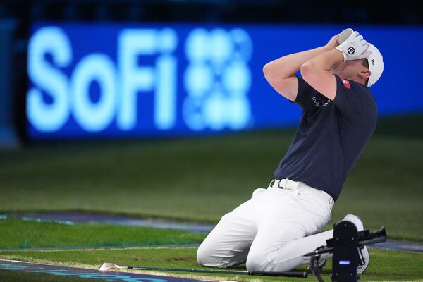 Matt Fitzpatrick of New York Golf Club reacts after a shot during the inaugural match of the TMRW Golf League, against The Bay Golf Club, Tuesday, Jan. 7, 2025, in Palm Beach Gardens, Fla. TGL features six teams of four players competing against each other in a tech-infused arena the size of a football field. (AP Photo/Rebecca Blackwell)