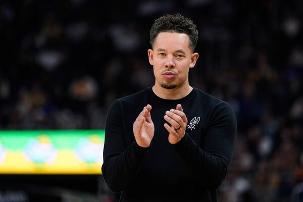 San Antonio Spurs interim head coach Mitch Johnson reacts during the first half of an NBA basketball game against the Golden State Warriors, Wednesday, April 9, 2025, in San Francisco. (AP Photo/Godofredo A. Vásquez)