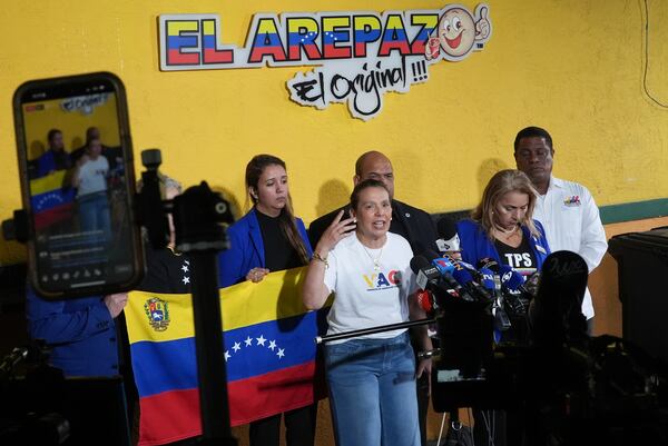 Adelys Ferro, executive director of grassroots organization the Venezuelan American Caucus, speaks during a press conference by Venezuelan community leaders to denounce an end to the protections that shielded hundreds of thousands of Venezuelans from deportation, Monday, Feb. 3, 2025, at El Arepazo restaurant in Doral, Fla. (AP Photo/Rebecca Blackwell)