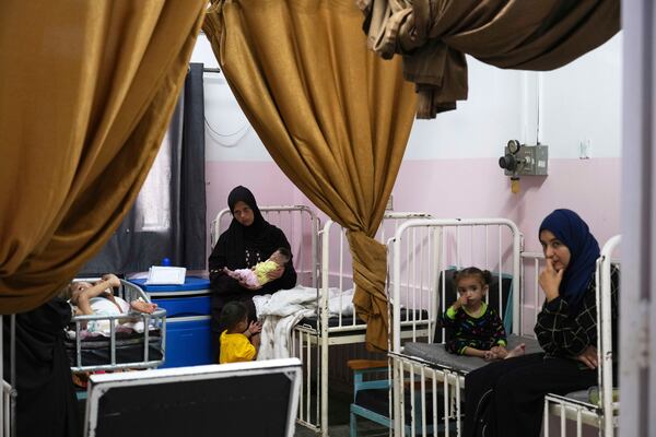 Mayar Al-Arja, 2, right, and 5-month-old Yousef Al-Najjar, both suffering from malnutrition, are cared for by their mothers in a clinic in Nasser Hospital, Khan Younis, Gaza, on Wednesday, May 21, 2025. (AP Photo/Abdel Kareem Hana)