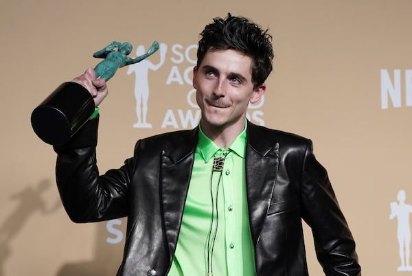 Timothee Chalamet poses in the press room with the award for outstanding performance by a male actor in a leading role for "A Complete Unknown" during the 31st annual Screen Actors Guild Awards on Sunday, Feb. 23, 2025, at the Shrine Auditorium in Los Angeles. (Photo by Jordan Strauss/Invision/AP)