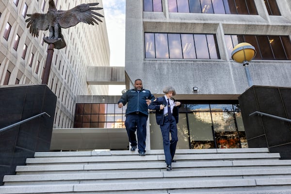 New Orleans Police Superintendent Anne Kirkpatrick, right, walks out of the Federal Courthouse, Tuesday, Jan. 14, 2025, in New Orleans, after a judge ruled the New Orleans Police Department can begin the process of ending longstanding federal oversight. (Chris Granger/The Times-Picayune/The New Orleans Advocate via AP)