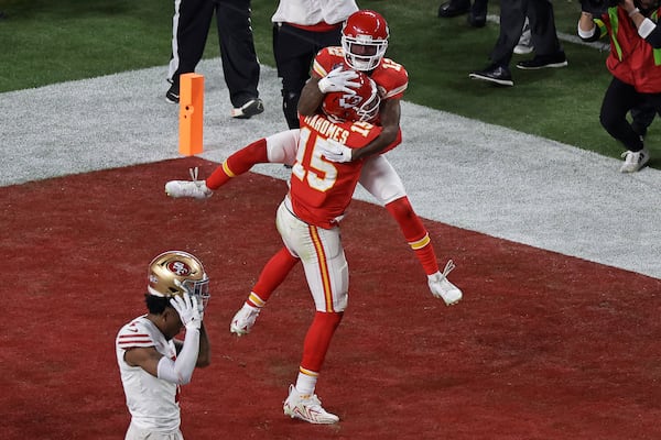 FILE - Kansas City Chiefs wide receiver Mecole Hardman Jr. (12) celebrates with Patrick Mahomes (15) after scoring the game winning touchdown in overtime as San Francisco 49ers place kicker Jake Moody (4) walks off the field during the NFL Super Bowl 58 football game Sunday, Feb. 11, 2024, in Las Vegas.(AP Photo/Adam Hunger, File)