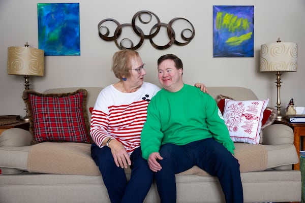 Paul Safarik, 32, sits with his mother, Deb, on Wednesday, Feb. 12, 2025, in Lincoln, Neb. (AP Photo/Rebecca S. Gratz)