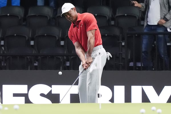 Tiger Woods warms up before a match against Los Angeles Golf Club and his team the Jupiter Links Golf Club, Tuesday, Jan. 14, 2025, in Palm Beach Gardens, Fla. (AP Photo/Marta Lavandier)