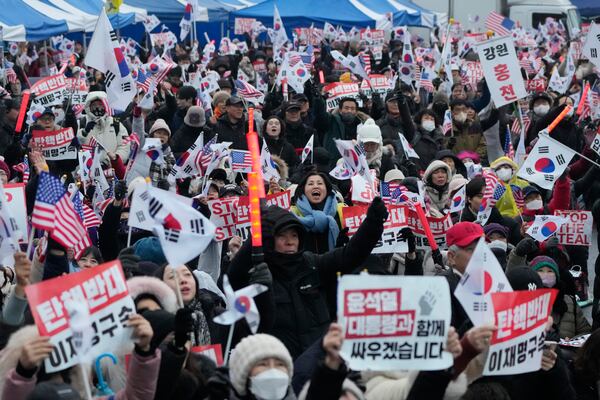 Supporters of impeached South Korean President Yoon Suk Yeol attend a rally to oppose his impeachment near the presidential residence in Seoul, South Korea, Monday, Jan. 6, 2025. (AP Photo/Ahn Young-joon)