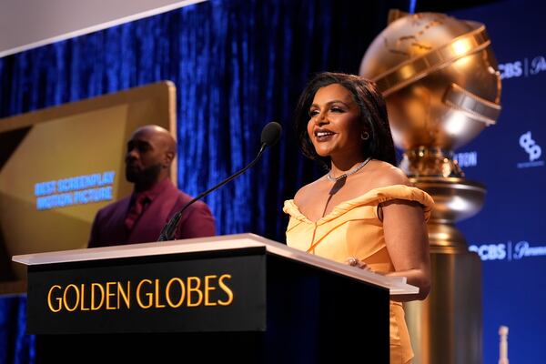 Mindy Kaling, right, speaks as Morris Chestnut looks on during the nominations for the 82nd Golden Globes on Monday, Dec. 9, 2024, at the Beverly Hilton Hotel in Beverly Hills, Calif. The 82nd Golden Globes will be held on Sunday, Jan. 5, 2025. (AP Photo/Chris Pizzello)