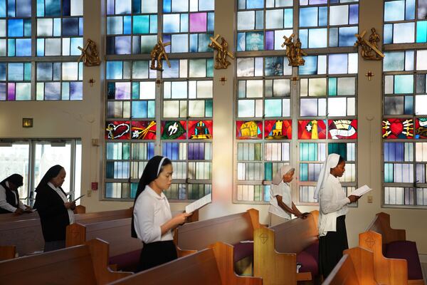 Sisters of the Holy Family sing during Mass in the chapel of the motherhouse in New Orleans, Wednesday, June 26, 2024. (AP Photo/Jessie Wardarski)