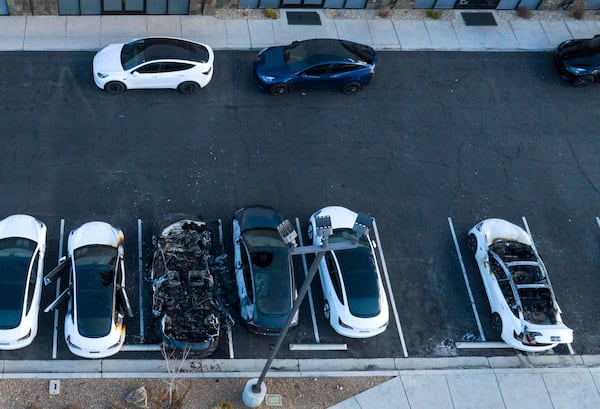 Police are investigating after several vehicles were set on fire at a Tesla service center, Tuesday, March 18, 2025, in Las Vegas. (Bizuayehu Tesfaye/Las Vegas Review-Journal via AP)