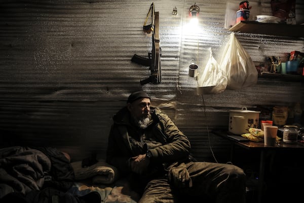 In this photo provided by Ukraine's 24th Mechanised Brigade press service, servicemen rest on the front line near Chasiv Yar, Donetsk region, Ukraine, Thursday, Feb. 7, 2025. (Oleg Petrasiuk/Ukraine's 24th Mechanised Brigade via AP)