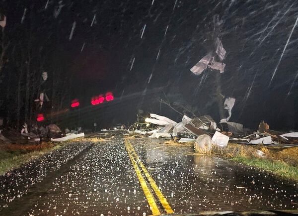 Debris covers the road during a severe storm passed the area north of Seymour, Mo., in Webster County late Friday, March 14, 2025. (Trooper Austin James/Missouri State Highway Patrol via AP)