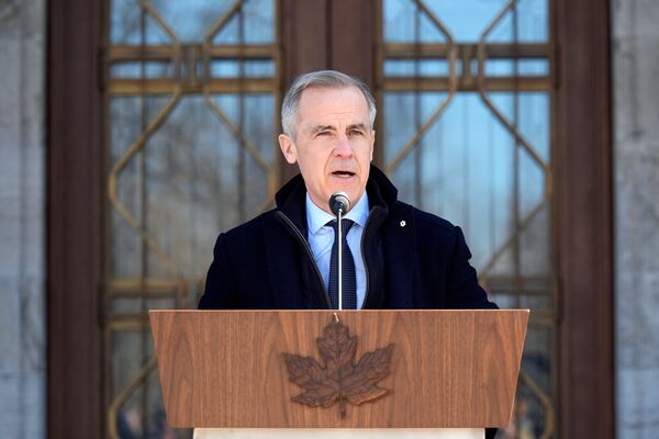 Prime Minister Mark Carney speaks to media at Rideau Hall, where he asked the Governor General to dissolve Parliament and call an election, in Ottawa, Sunday, March 23, 2025. THE CANADIAN PRESS/Adrian Wyld/The Canadian Press via AP) /The Canadian Press via AP)