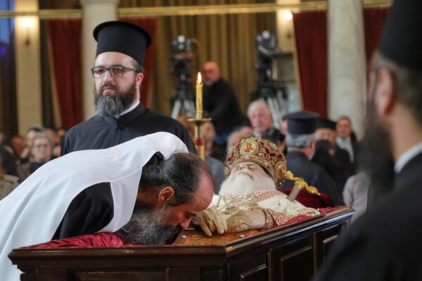 Patriarch Daniel of Bulgaria pays his respects to the late Archbishop Anastasios of Tirana, Durres and All Albania during his funeral, inside the Cathedral of the Resurrection of Christ, in Tirana, Albania, Thursday, Jan. 30, 2025. (AP Photo/Vlasov Sulaj)