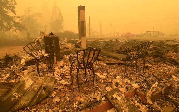 FILE - Chairs stand at a post office in the aftermath of the Santiam Fire in Gates, Ore., Sept 9, 2020. (Mark Ylen/Albany Democrat-Herald via AP, File)