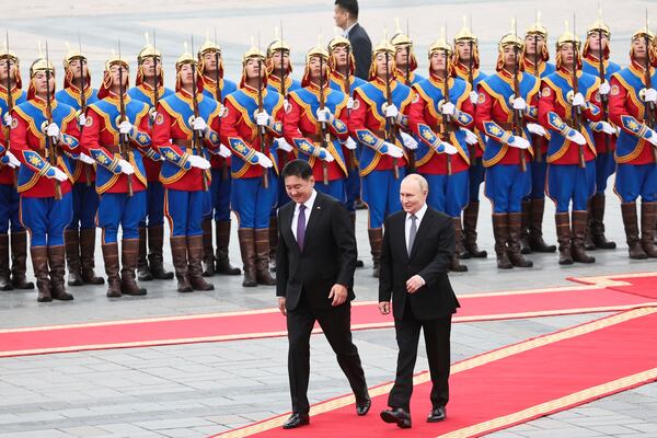 FILE - Mongolian President Khurelsukh Ukhnaa, left, walks with Russian President Vladimir Putin during a welcome ceremony in Sukhbaatar Square in Ulaanbaatar, Mongolia, on Sept. 3, 2024. (Sofya Sandurskaya, Sputnik, Kremlin Pool Photo via AP, File)